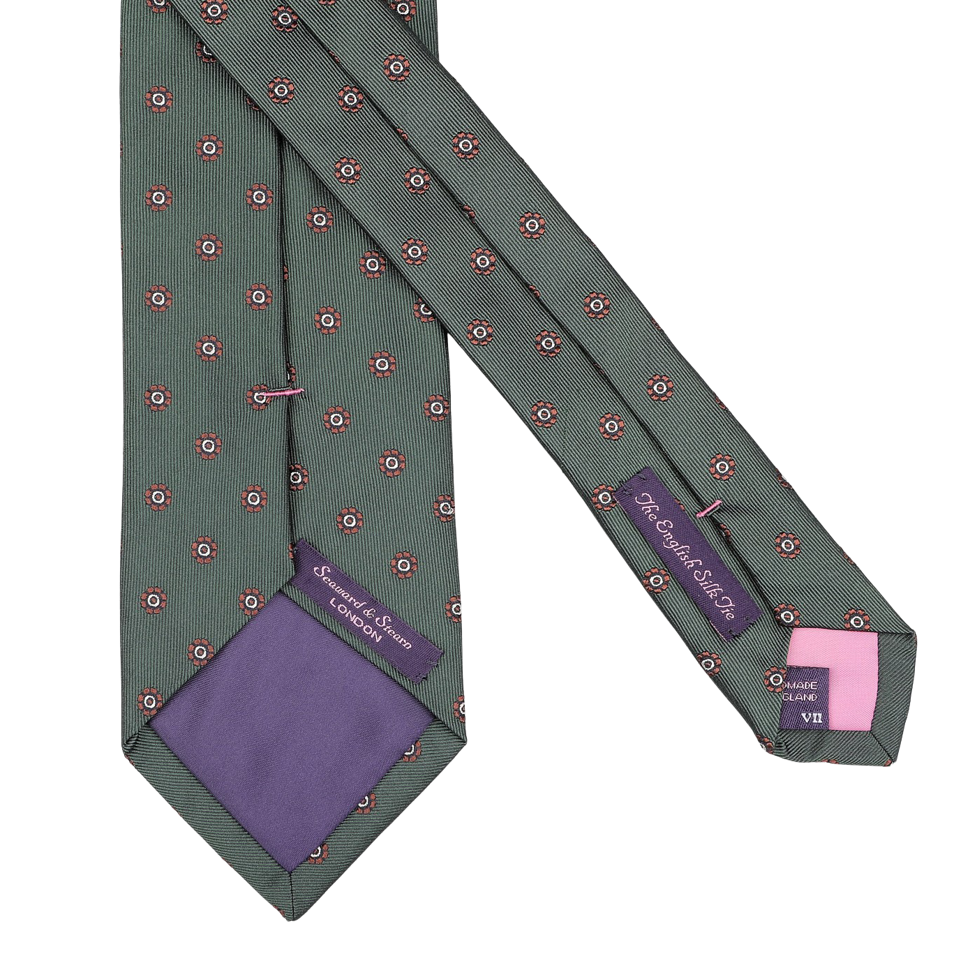 The Bottle Green Printed Medallion Silk Tie from Seaward & Stearn showcases a handmade design in a light green shade, adorned with delicate red and white floral patterns. This exquisite piece features a purple lining and visible brand labels, seamlessly blending elegance with exceptional craftsmanship.