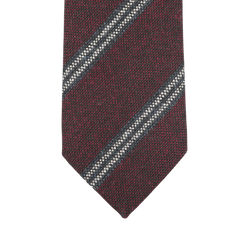 Handmade in England by Seaward & Stearn, the Burgundy Blue Striped Wool Tie showcases an elegant close-up of its diagonal blue and white stripes.