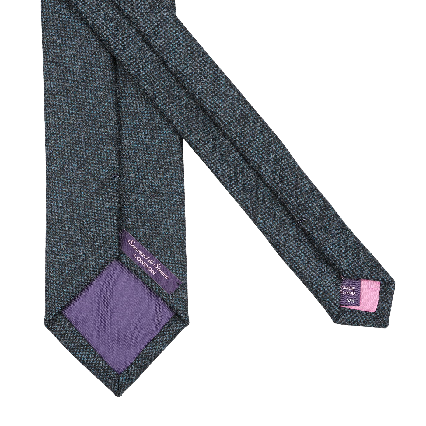 Introducing the Dark Blue Woven Wool Tie by Seaward & Stearn, featuring a rich dark blue design with a purple lining and adorned with two labels, one purple and one gray, at the ends. Handmade in England from pure wool, this exquisite accessory embodies refined elegance.