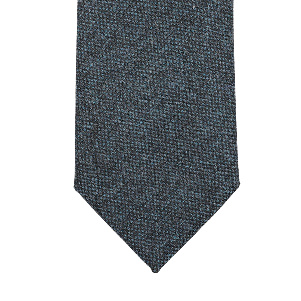 Dark blue woven tie with a pointed tip, handmade in England from pure wool by Seaward & Stearn.