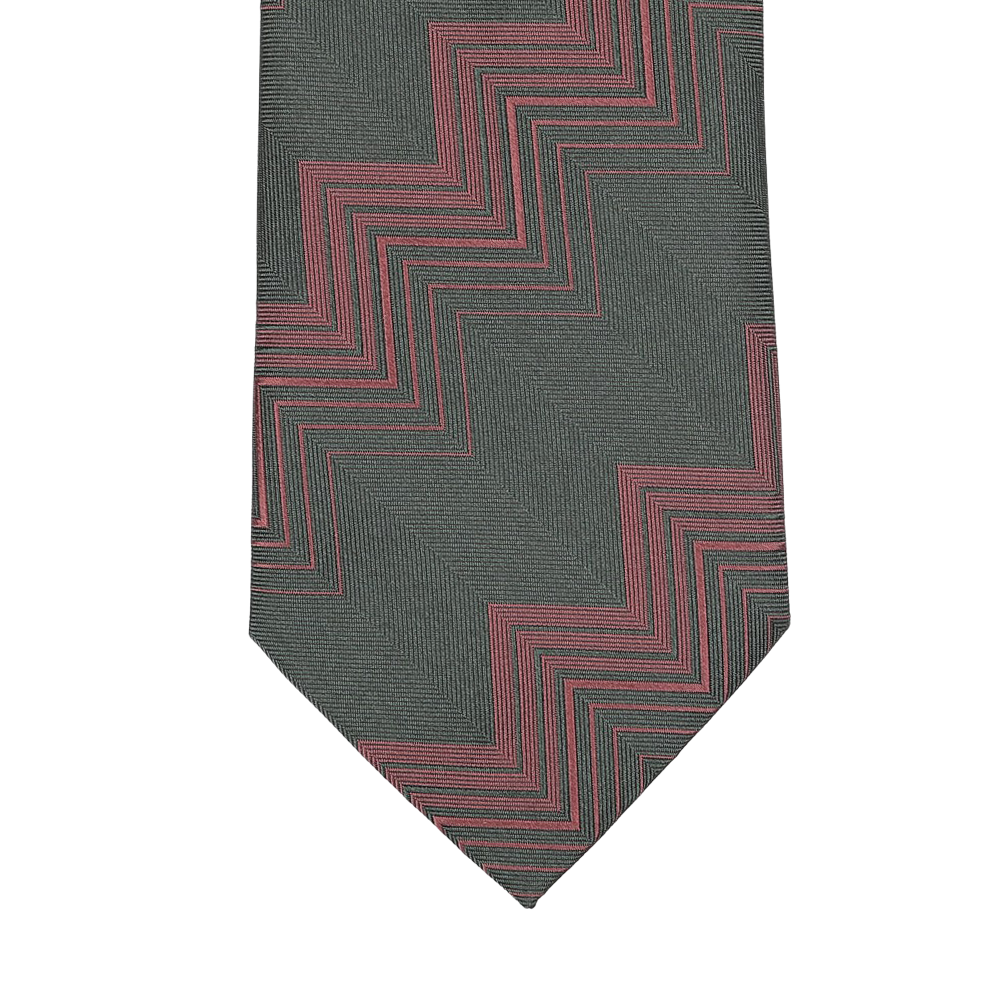 Close-up of a Seaward & Stearn handmade silk tie featuring a herringbone zigzag pattern in dark green tones.