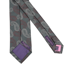 Dark green handmade silk tie with a large paisley design by Seaward & Stearn, featuring visible labels against a crisp white background.