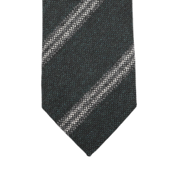 The Dark Green Striped Wool Tie by Seaward & Stearn is handmade in England and exudes quality and style with its dark green textured appearance and a diagonal light-colored stripe.