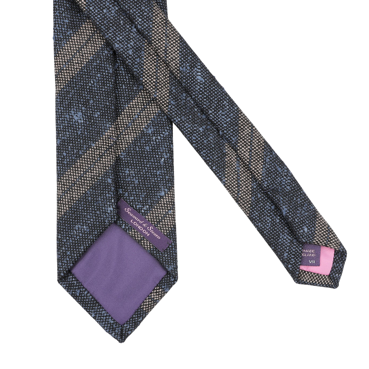 A close-up of the Grey Blue Striped Wool Tie by Seaward & Stearn, handmade in England from pure wool. It showcases diagonal stripes in dark colors, a purple lining, and labels visible on the back.