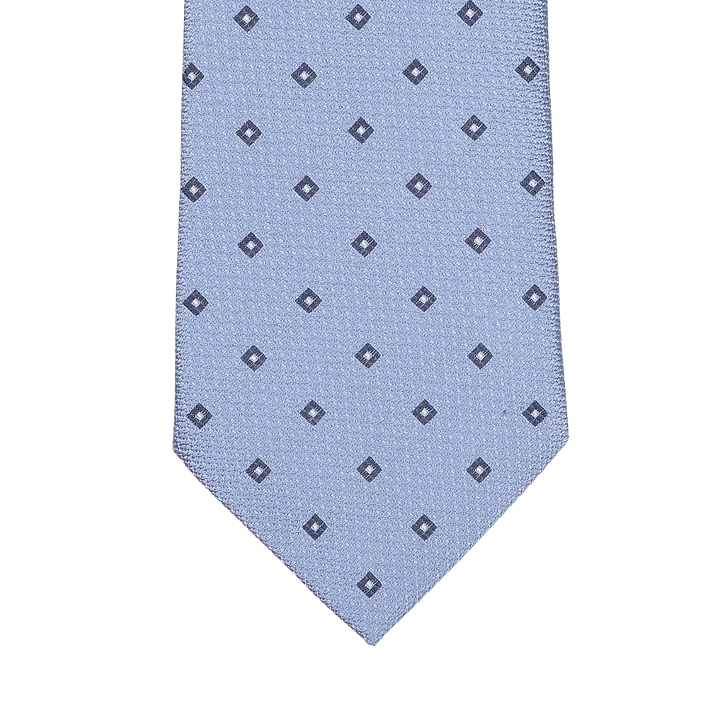 A light blue silk tie from Seaward & Stearn, featuring a pattern of small navy square dots arranged in a grid, expertly handmade in England.