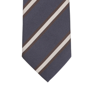 Close-up of the Navy Blue Brown Striped Silk Tie by Seaward & Stearn, handmade in England, featuring diagonal stripes in white and brown.