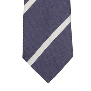 Close-up of the Seaward & Stearn Navy Blue Cream Striped Silk Tie, meticulously handmade in England from luxurious silk, featuring two diagonal white stripes.