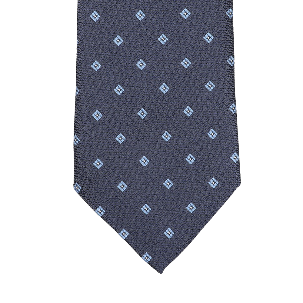 The Seaward & Stearn Navy Blue Diamond Woven Silk Tie is a handmade silk masterpiece, showcasing a navy blue color with an intricate pattern of small light blue square motifs.