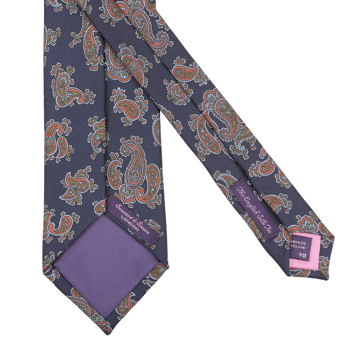 Presenting the Seaward & Stearn Navy Blue Paisley Printed Silk Tie, this exquisite accessory is handmade in England from luxurious silk and features elegant purple accents along with two tags on the back.