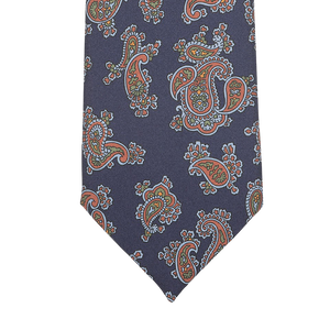 Introducing the Navy Blue Paisley Printed Silk Tie by Seaward & Stearn, a finely handcrafted accessory made in England that features a stunning pattern of navy blue intertwining with vibrant red, blue, and green hues.