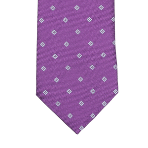 Handmade in England by Seaward & Stearn, the Purple Diamond Woven Silk Tie boasts a refined pattern of small white squares, offering a sophisticated touch for any occasion.