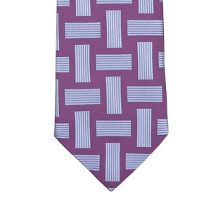 The Purple Geometric Printed Silk Tie by Seaward & Stearn showcases a design of interlocking blue rectangles and stripes and is handmade in England.