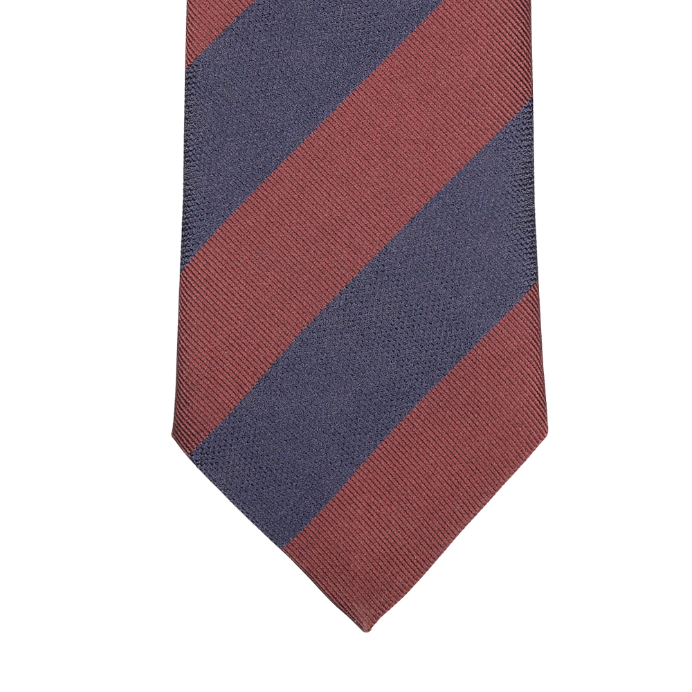 A detailed view of the Rust Blue Striped Silk Tie by Seaward & Stearn, featuring diagonal maroon and navy blue stripes set against a light gray background, expertly handcrafted in England.