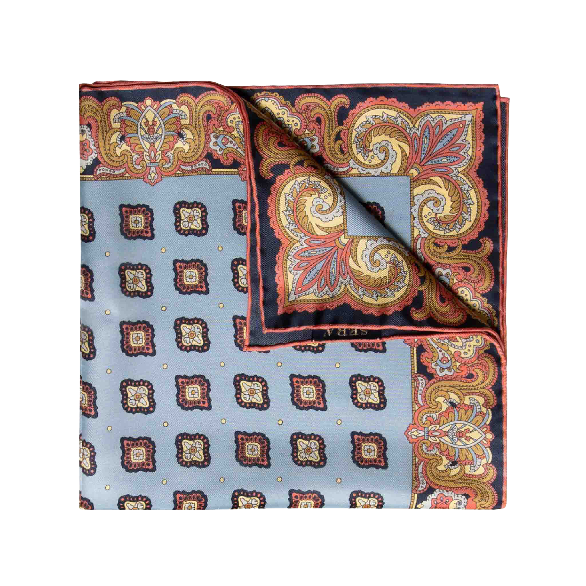 The Cardo Light Blue Silk Pocket Square by Sera Fine Silk features a folded square scarf with a paisley and geometric design in shades of blue, red, orange, and yellow, complemented by hand-rolled edges.