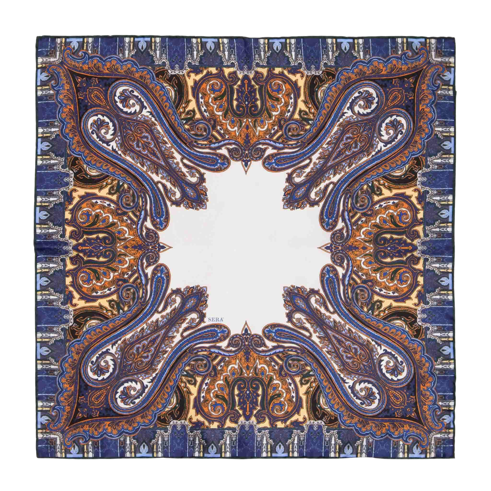 The Cortina Blue Silk Pocket Square by Sera Fine Silk showcases an intricate paisley pattern in shades of blue, orange, and gold, with a central white area and exquisite hand-rolled edges.