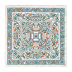 The Vernazza Cream Silk Pocket Square by Sera Fine Silk is a luxurious square piece of fabric adorned with an intricate pattern featuring blue, green, and orange paisley designs on a white background. Made from Como silk, this pocket square features hand-rolled edges for a refined finish.