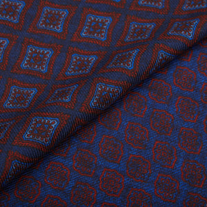 A close-up of a Navy Red Geometric Wool Silk Double Sided Scarf, designed by Silvio Fiorello.