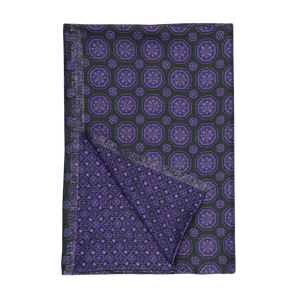 A green and purple geometric patterned double sided scarf by Silvio Fiorello.