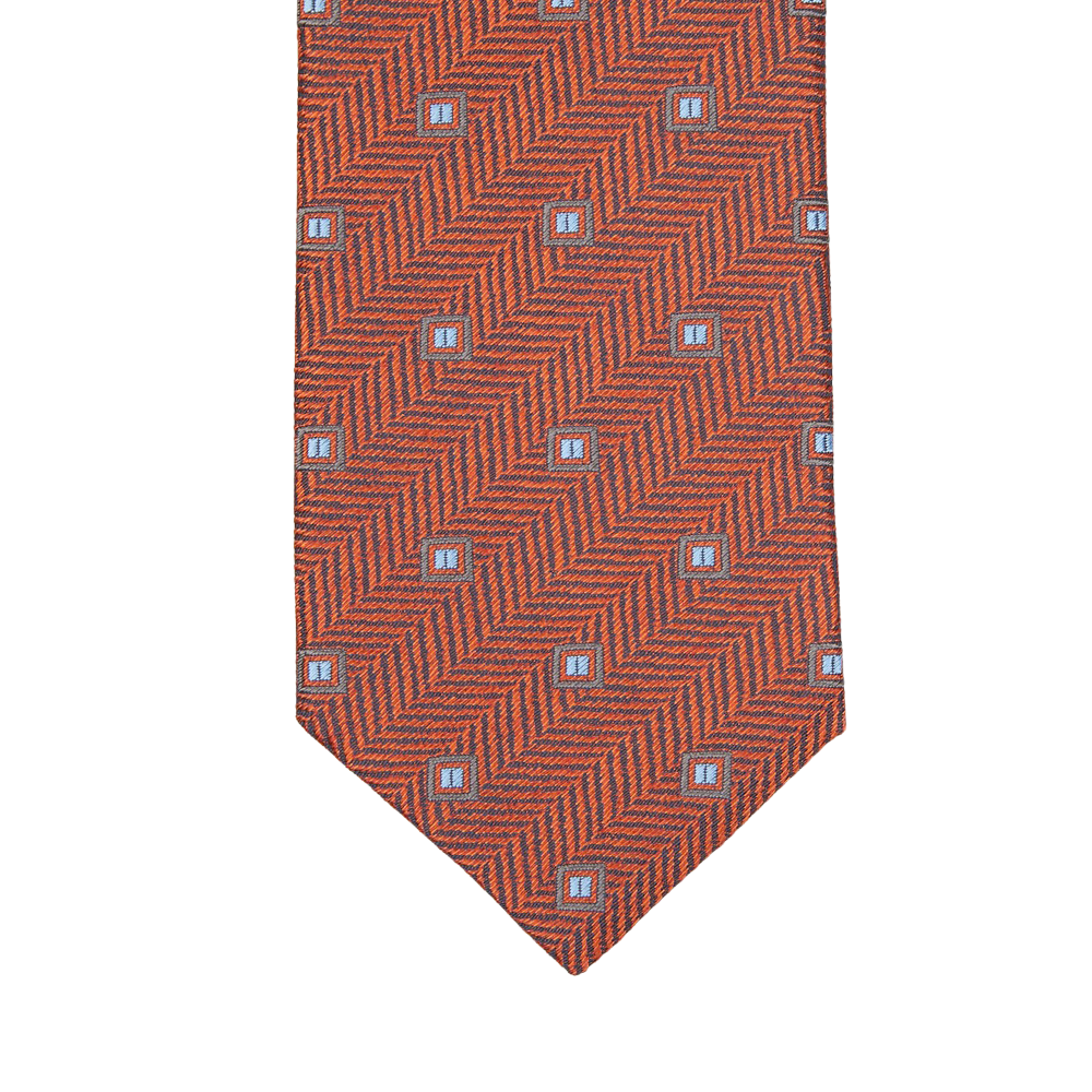 A Silvio Fiorello necktie with an Orange Herringbone Woven Silk Tie pattern.