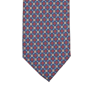 Close-up of a Stefano Cau Blue Burgundy Flower Printed Silk Lined Tie featuring a geometric design in vibrant red, blue, and white, made from luxurious Italian Como silk.