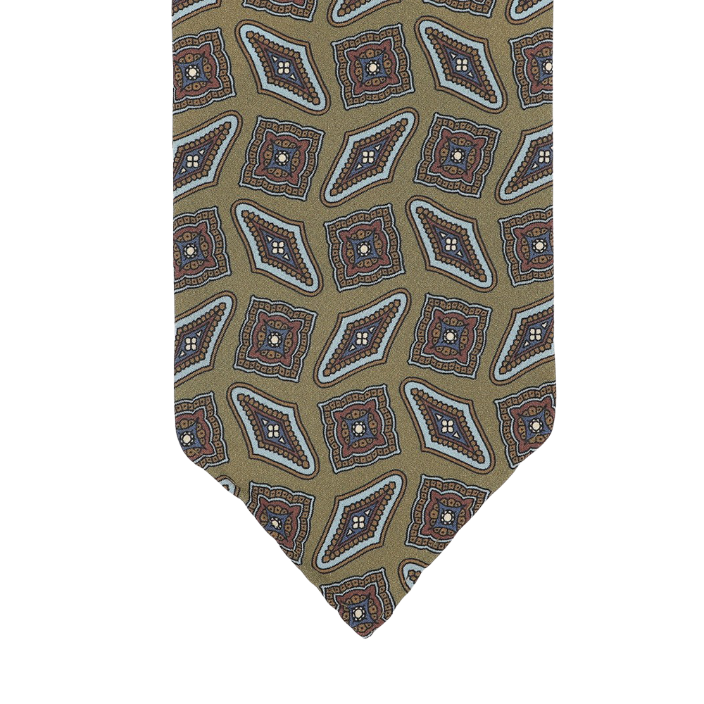 Close-up of a Stefano Cau Cactus Green Kilim Printed Silk Unlined Tie, featuring an Italian Como silk design with an olive green background and a geometric pattern in red, blue, and white.