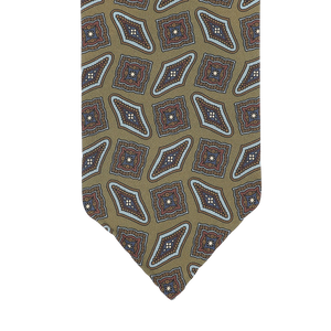 Close-up of a Stefano Cau Cactus Green Kilim Printed Silk Unlined Tie, featuring an Italian Como silk design with an olive green background and a geometric pattern in red, blue, and white.