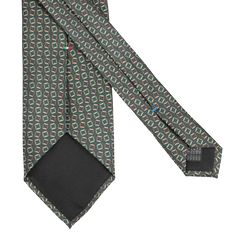 Stefano Cau introduces the Grass Green Square Printed Silk Lined Tie, featuring a geometric pattern in shades of grass green and red set against a gray backdrop, crafted from luxurious Italian Como silk and finished with a black lining at the tip.