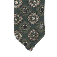 Stefano Cau's Green Medallion Printed Silk Unlined Tie is meticulously crafted from the finest Italian Como silk and showcases a repeating pattern of ornate circular designs in beige, blue, and orange tones.