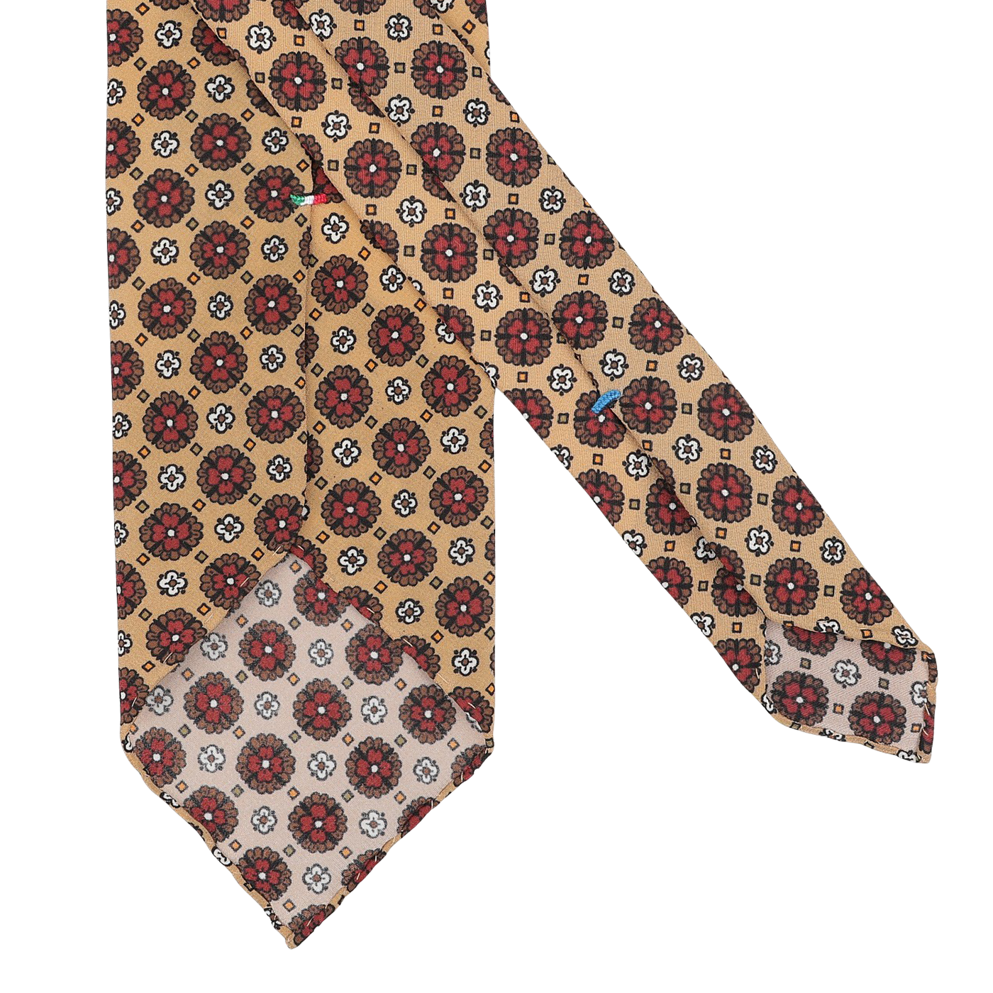 Made from premium Italian Como silk, the Yellow Flower Printed Silk Unlined Tie by Stefano Cau showcases a stylish beige pattern of red and brown circular floral motifs highlighted by subtle white flowers.