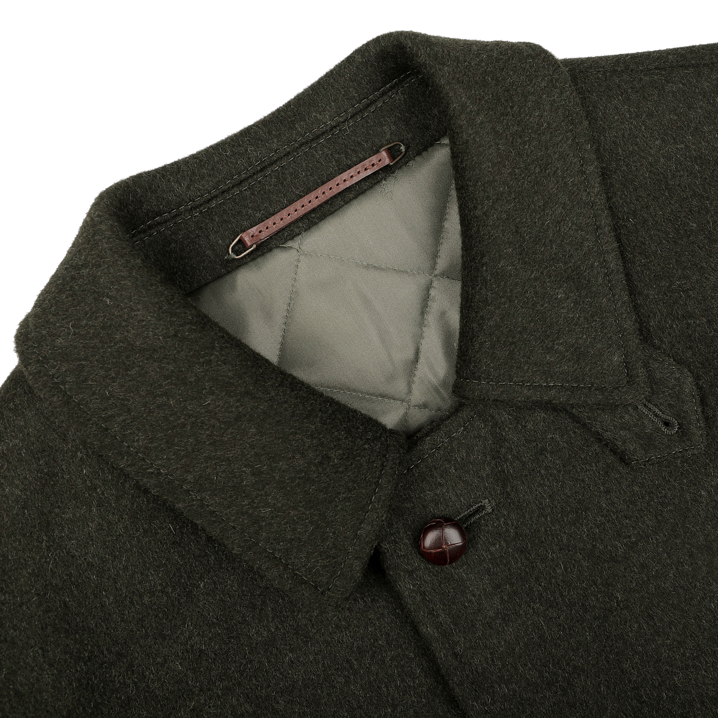 Steinbock's Dark Green Wool Alpaca Loden Coat exudes a refined style, featuring a quilted interior, pointed collar, and a single visible leather football button on the front.