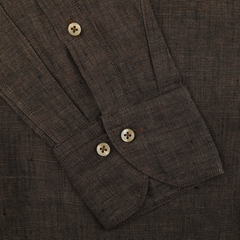 Close-up of Stenströms' Dark Brown Linen Cutaway Slimline Shirt sleeve, highlighting two light brown buttons and visible stitching—an essential for summer.