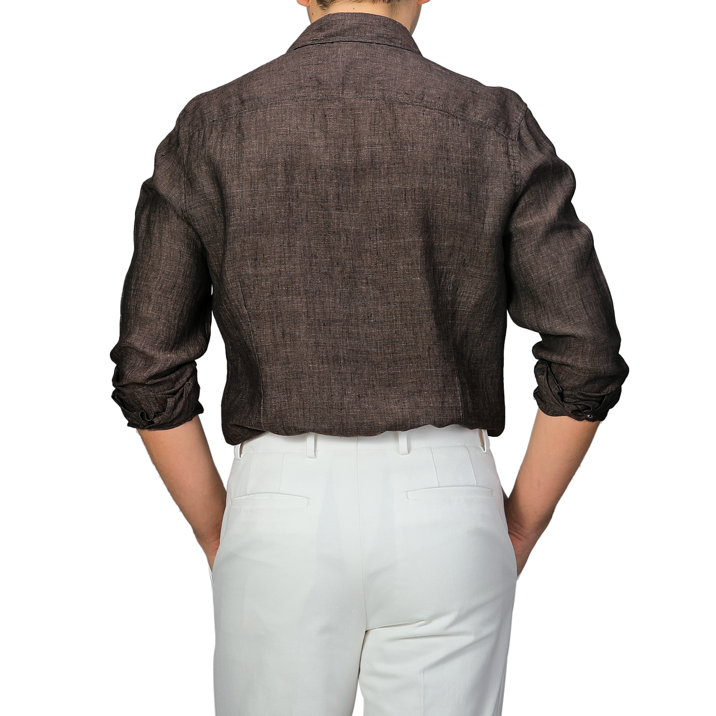 Back view of a person wearing Stenströms' Dark Brown Linen Cutaway Slimline Shirt and white pants, with arms resting on hips—a true summer essential.