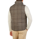 The back view of a man wearing a Stenströms Beige Checked Wool Down Padded Gilet.