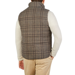 The back view of a man wearing a Stenströms Beige Checked Wool Down Padded Gilet.