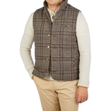 A man wearing a Stenströms Beige Checked Wool Down Padded Gilet.