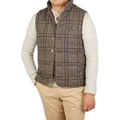 A man wearing a Stenströms Beige Checked Wool Down Padded Gilet.