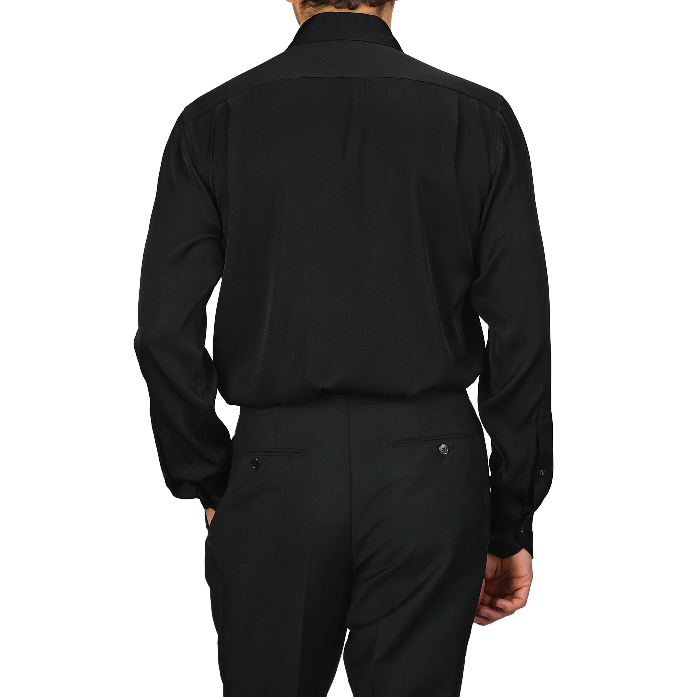 A person is styled in a sophisticated Black Silk Fitted Body Shirt, reminiscent of an elegant piece from Stenströms' collection, facing away from the camera.