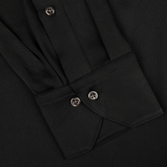 A close-up of the Stenströms Black Silk Fitted Body Shirt sleeve shows two buttons on the cuff and pleated fabric.