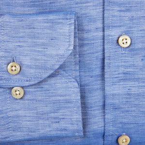 A close up of a Stenströms Blue Melange Cotton Linen Slimline Shirt with buttons made from a cotton-linen blend.