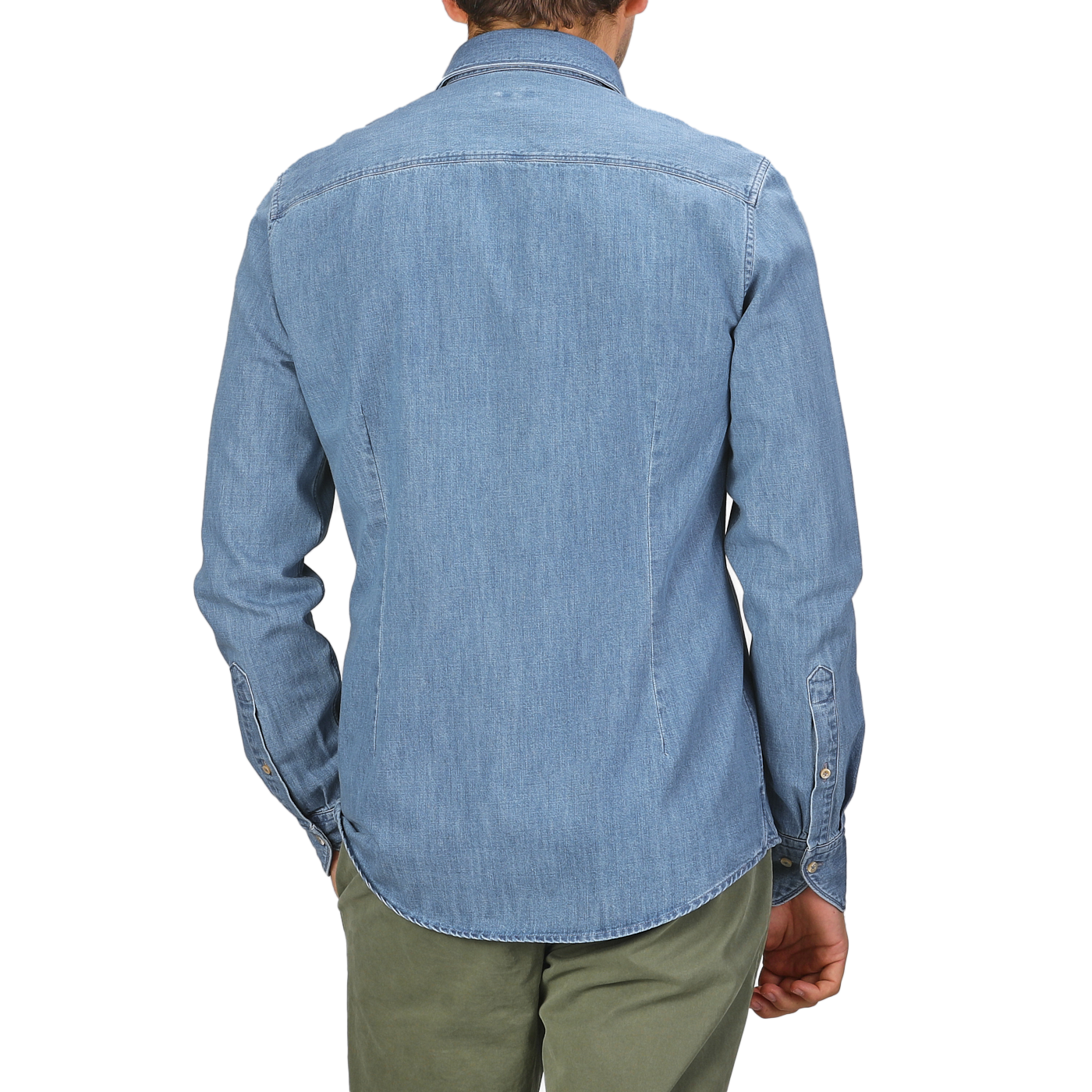 A man is seen from the back wearing a Blue Washed Cotton Denim Slimline Shirt by Stenströms, paired with green pants.