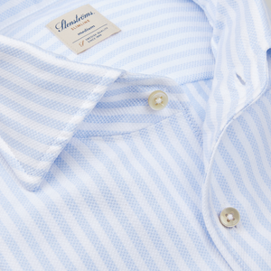 Close-up of a blue and white striped Stenströms Slimline shirt with a visible brand label.