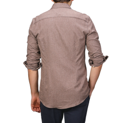 A person wearing the Brown Cotton Flannel Cut-Away Slimline Shirt by Stenströms and dark pants is seen from the back.