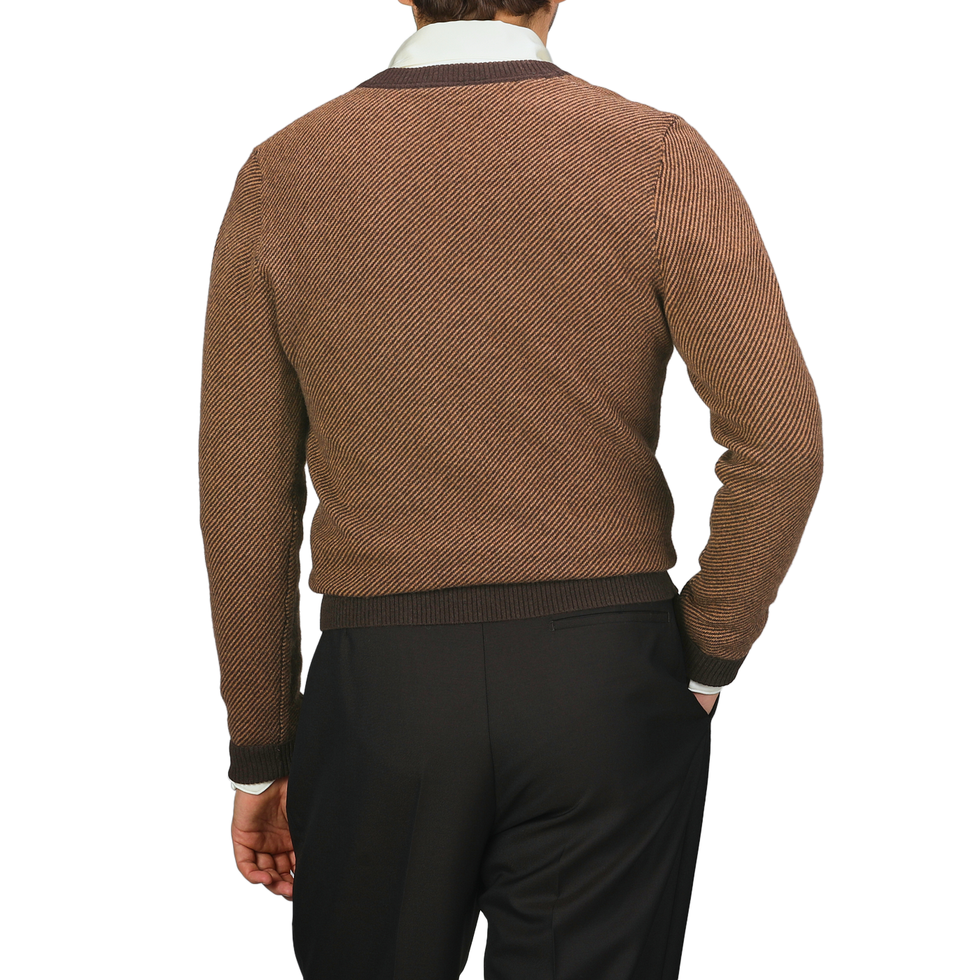 A person wearing a Camel Brown Striped Merino V-Neck Sweater by Stenströms and dark pants is facing away from the camera.