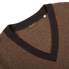 A detailed view of the Stenströms Camel Brown Striped Merino V-Neck Sweater against a pristine white backdrop.