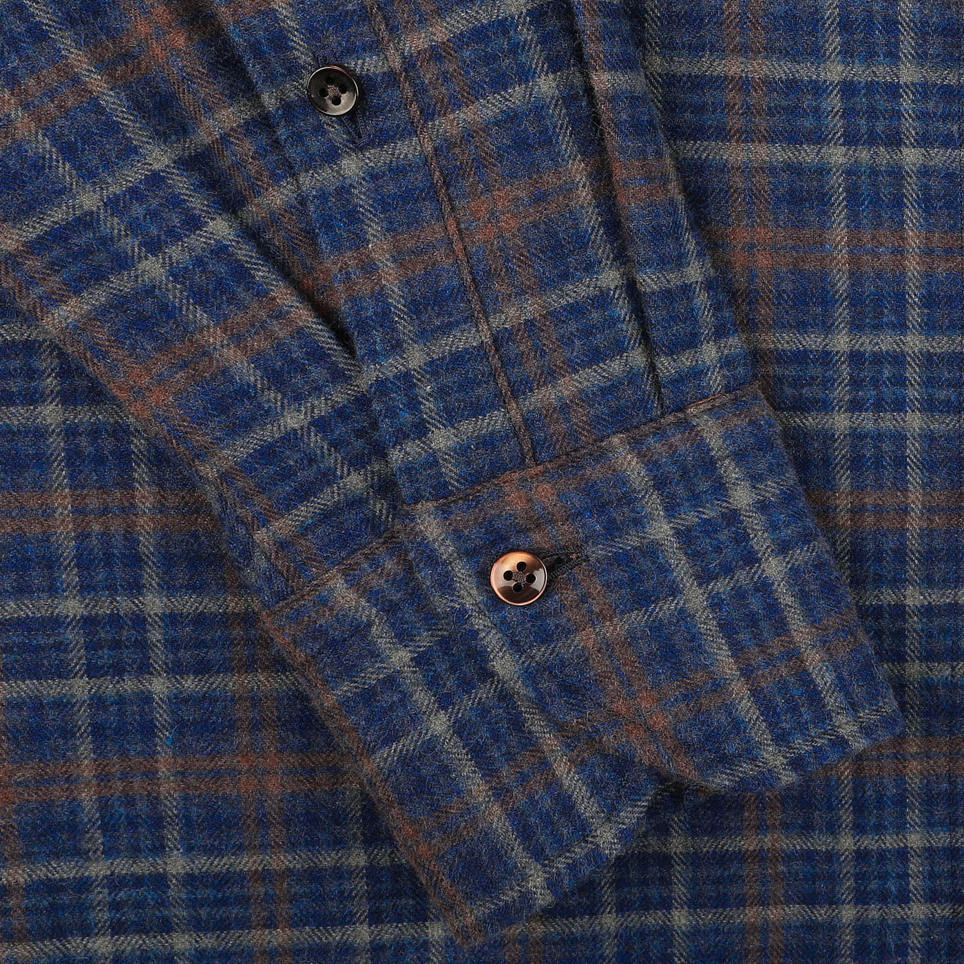 Close-up of a Dark Blue Checked Flannel Fitted Body BD Shirt sleeve by Stenströms, featuring two black buttons on the cuff.