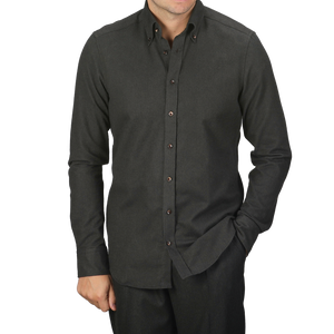 A person wearing a Stenströms Dark Green Melange Cotton Flannel Slimline Shirt with hands in pockets.