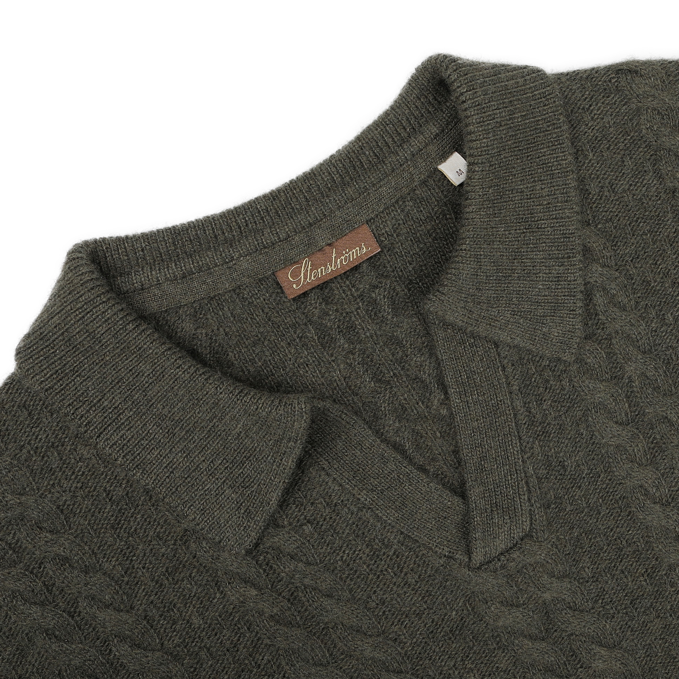 Close-up of the Dark Green Merino Cable Knit LS Polo with a folded collar, crafted by Stenströms.