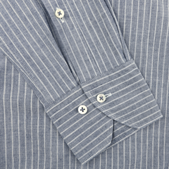 Close-up of Stenströms Dark Indigo Striped Washed Cotton Fitted Body Shirt, showcasing its sophisticated design with white vertical stripes, a cut-away collar, and detailed cuffs and buttons.