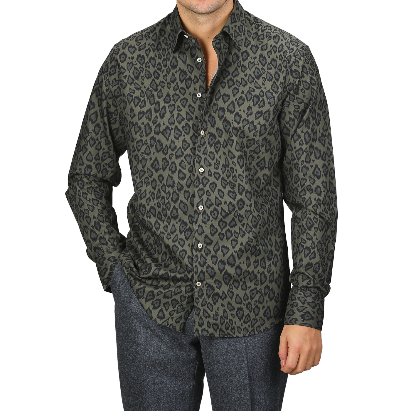 A person wearing a Green Animal Printed Fitted Body Shirt and gray pants stands against a plain background, showcasing a stylish selection from Stenströms.