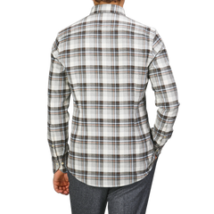 A person models the Stenströms Grey Checked Cotton Flannel Slimline BD Shirt from behind, stylishly paired with dark gray pants.